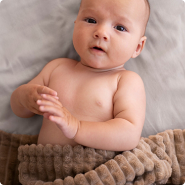 Baby resting on a blanket