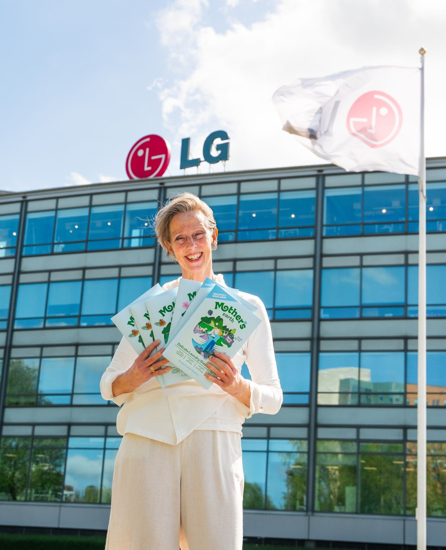 Lisette with Mother's Earth packs outside the LG building