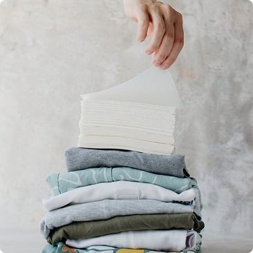 Laundry sheets on folded clothes